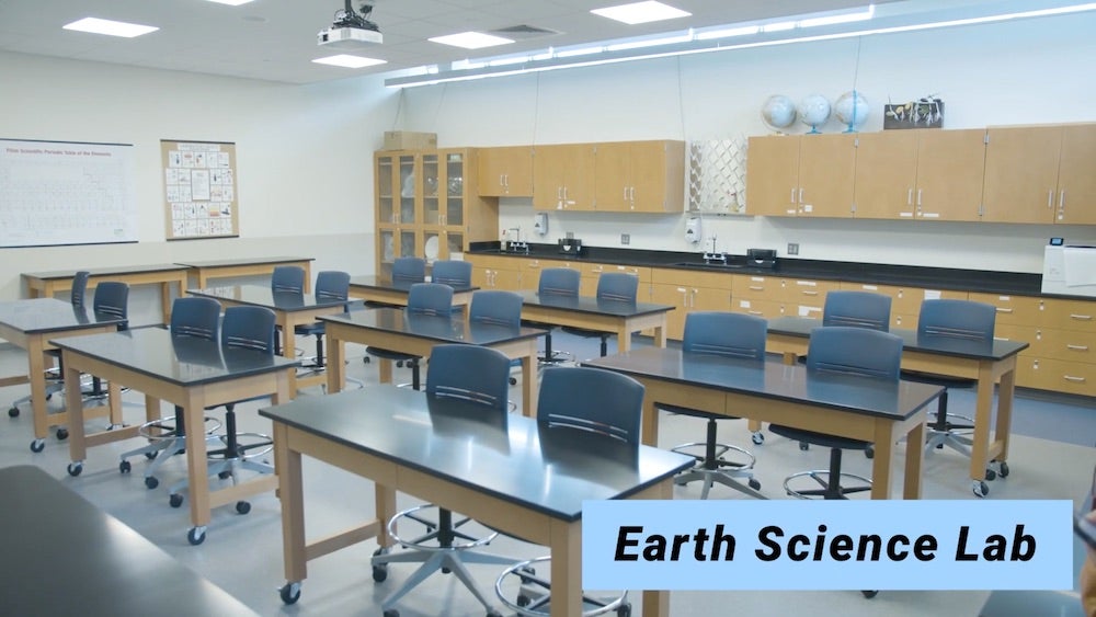 Photo of earth science lab room showing empty desks.