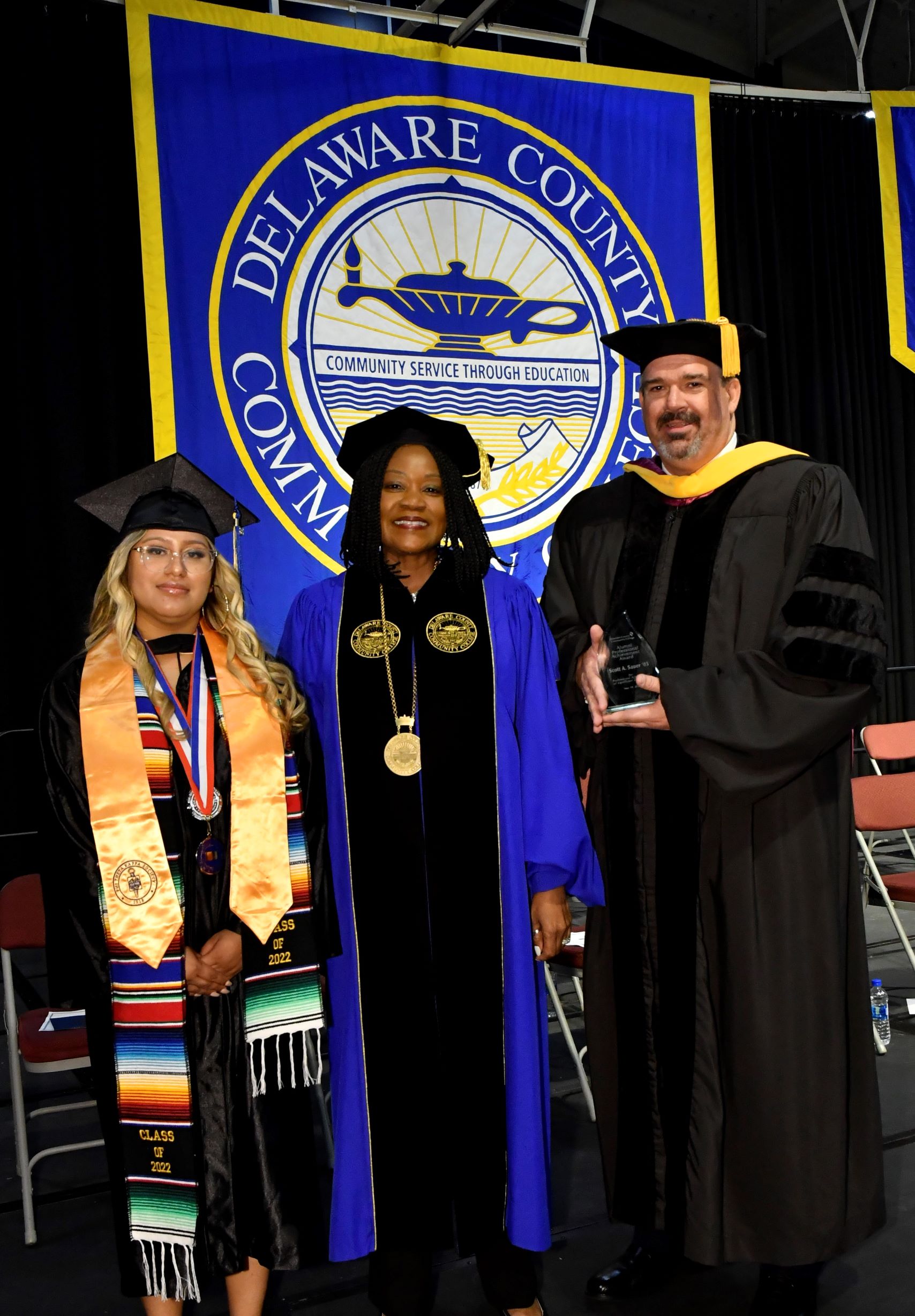 2022 Delaware County Community College graduate and Commencement student speaker Quetxalit Escalante of Thorndale, President Dr. L. Joy Gates Black, and 2022 Alumni Professional Achievement Award recipient Scott Sauer ‘03, SEPTA’s chief operating officer.