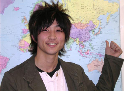 Photo of Seiya pointing at a map.