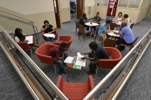 Students studying in a lounge area.