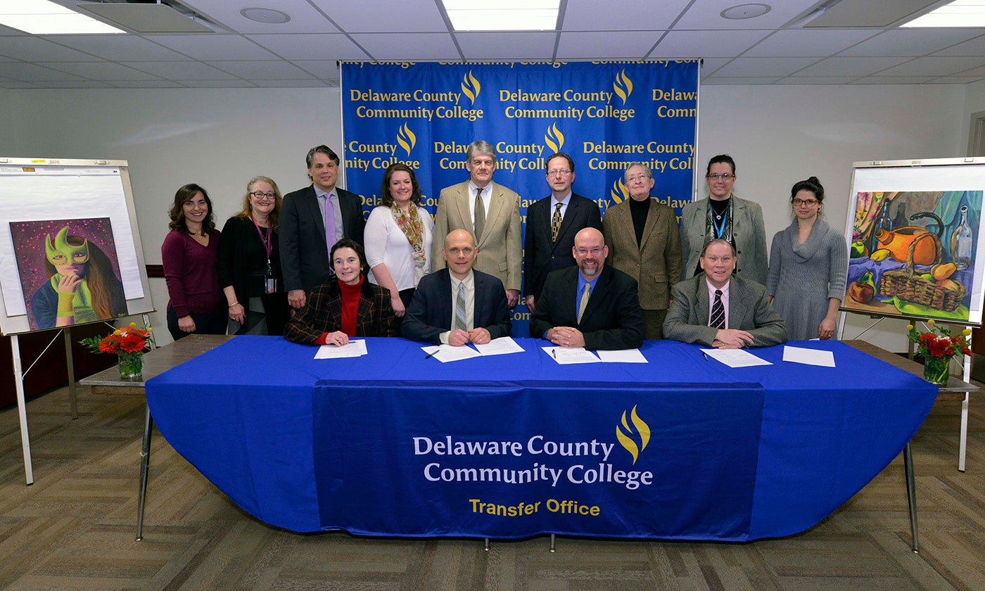 Officials from Delaware County Community College and the Pennsylvania Academy of the Fine Arts sign a new student transfer agreement at Delaware County Community College’s Marple Campus
