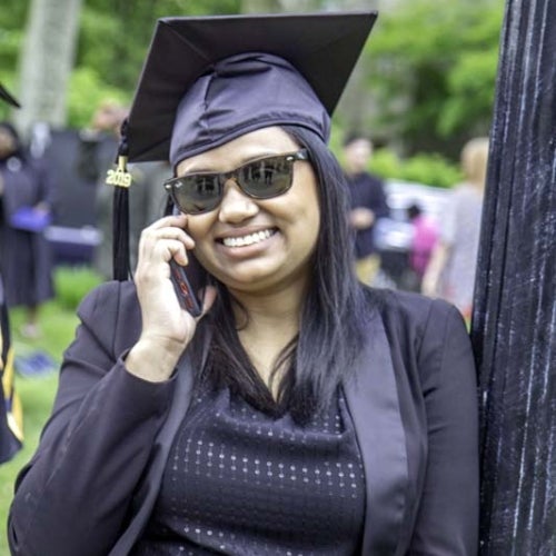 Graduate talking on the phone after graduation