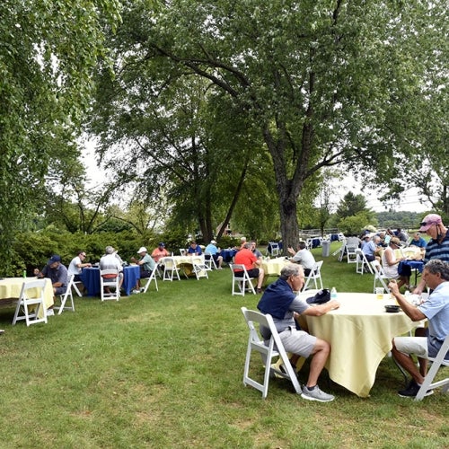 Golfers Sitting at Tables