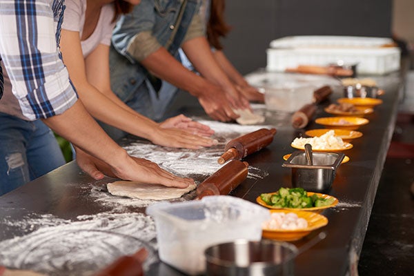 hands making pizza dough