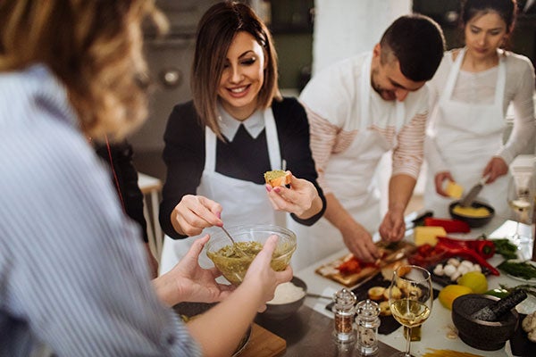 adults making appetizers