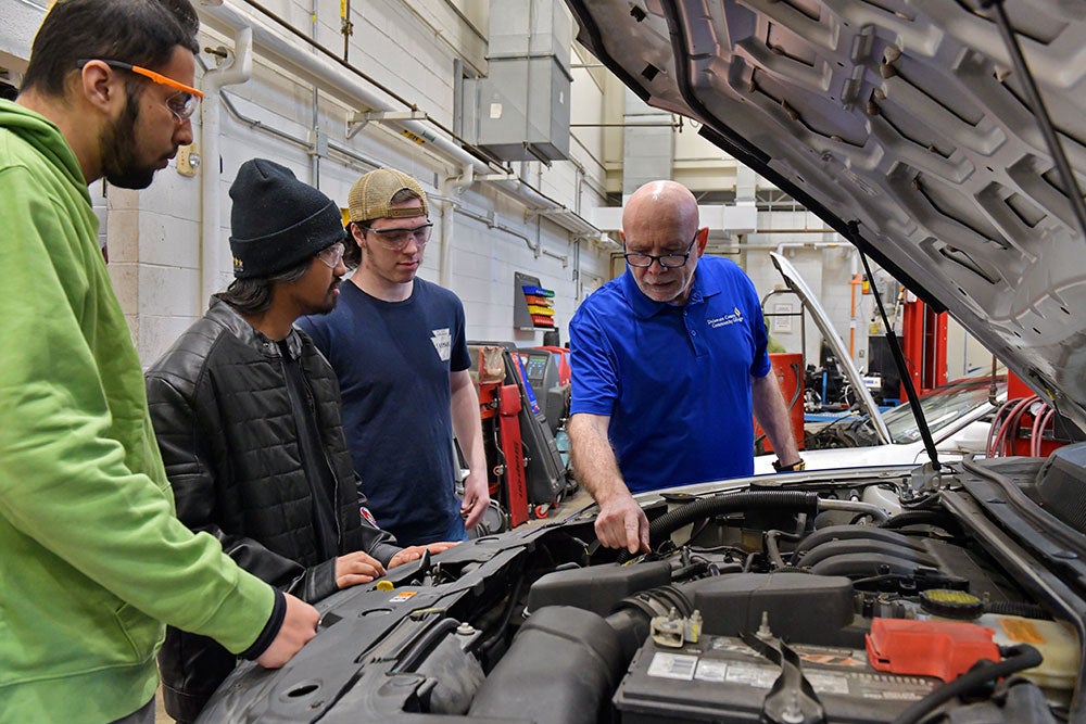 Automotive instructor with students