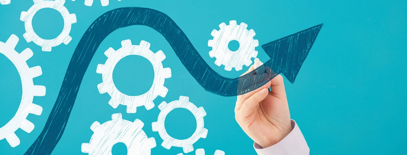 Hand drawing an upward arrow navigating through interconnected gears, symbolizing progress and project management.