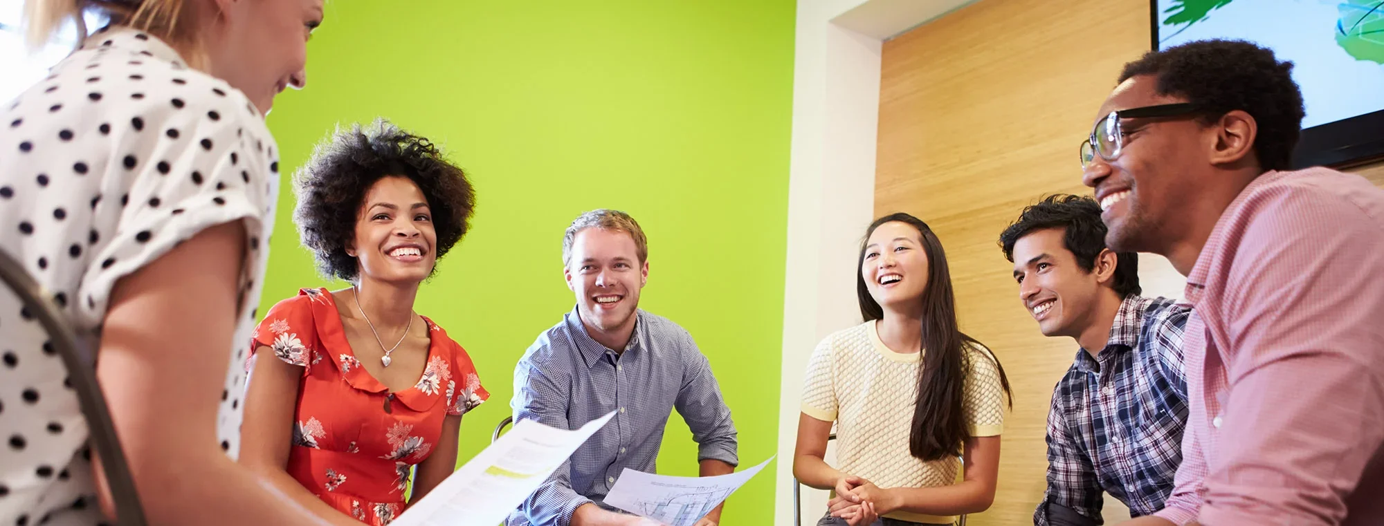 A group of students having a collaborative discussion in a classroom