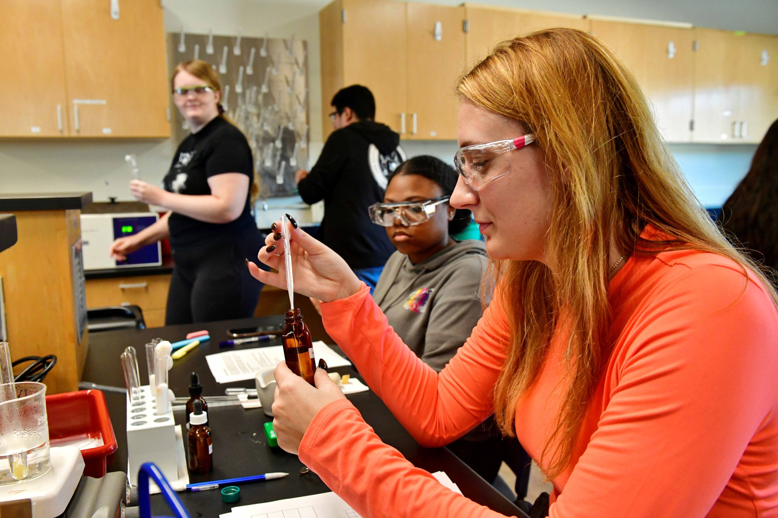 Students conducting chemistry lab experiments