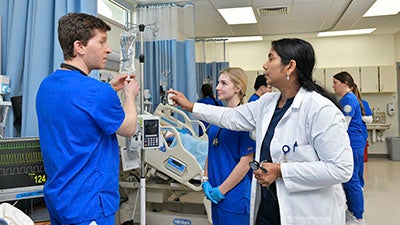 Nursing SIM lab with students and professor