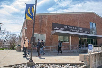 Students walking from class outside the Advanced Technology Center