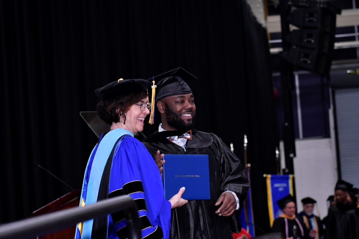 DCCC President Dr. Marta Yera Cronin congratulates a graduate.