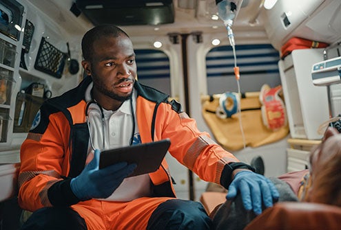 Male emergency responder in ambulance