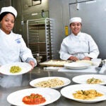 culinary arts students showing finished dishes