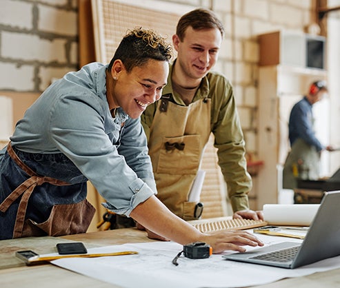 two small business owners working together
