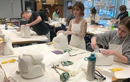 Student in Ceramics class