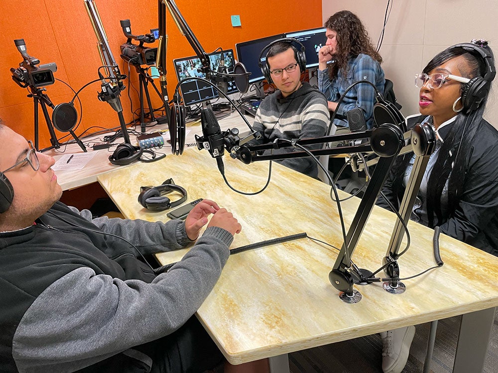 Students in the New Media Lab for podcast