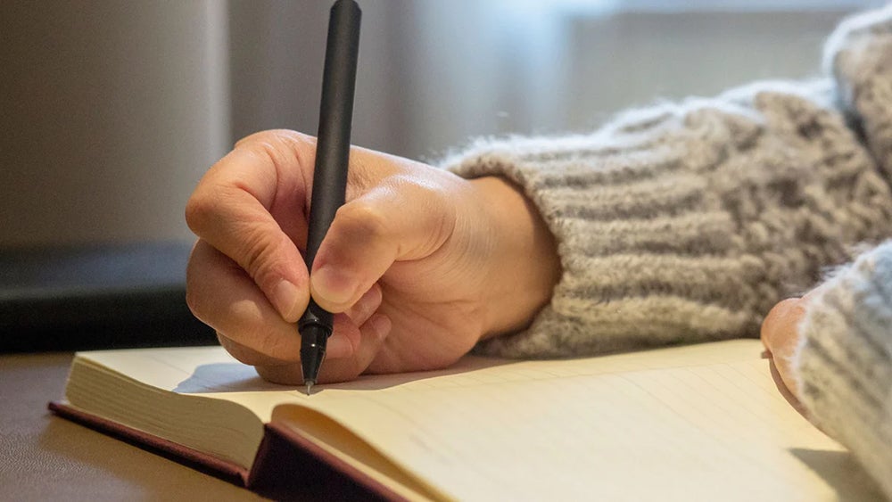 hand writing in journal