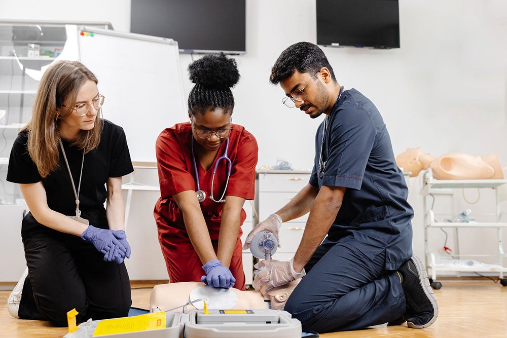 Three EMT students training