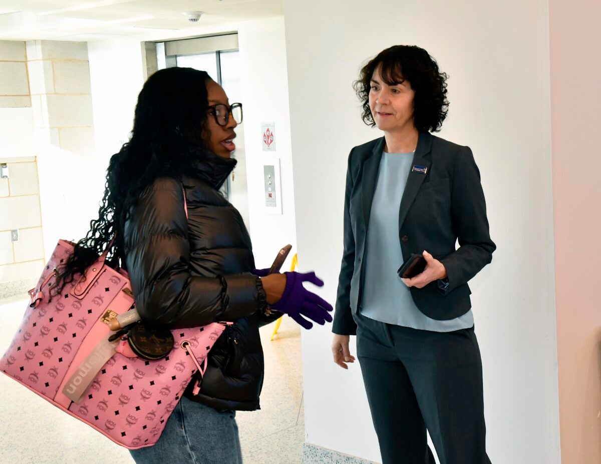 DCCC President Dr. Marta Yera Cronin greets a student at Southeast Center.