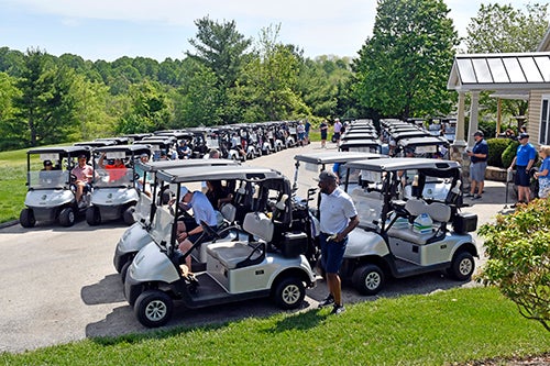 Golfers and golf carts