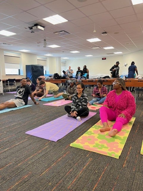 Women's Empowerment Initiative members participate in a yoga session.