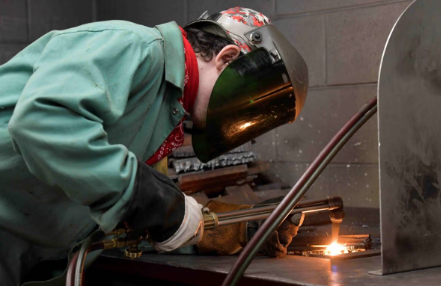 Student welding during National Apprenticeship Week.