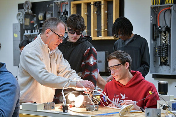 electrical students observing instructor's lesson