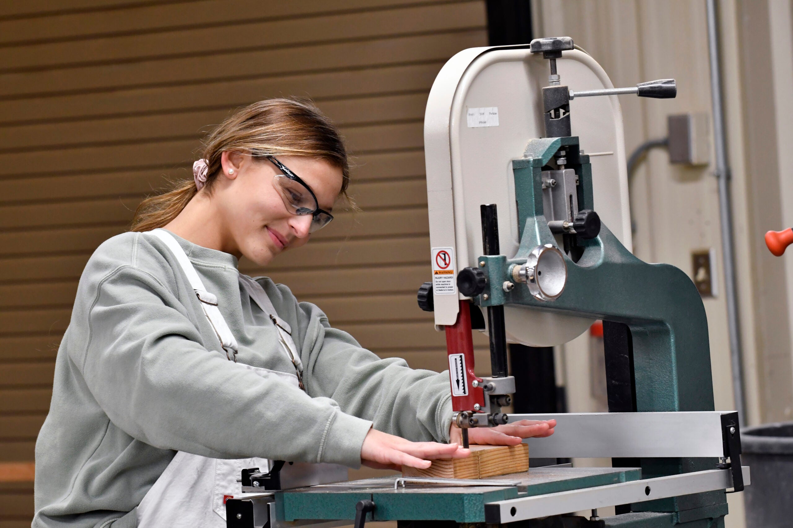 A female DCCC Carpentry student at work.
