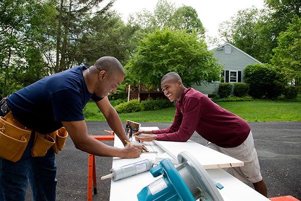 Father and son working on carpentry