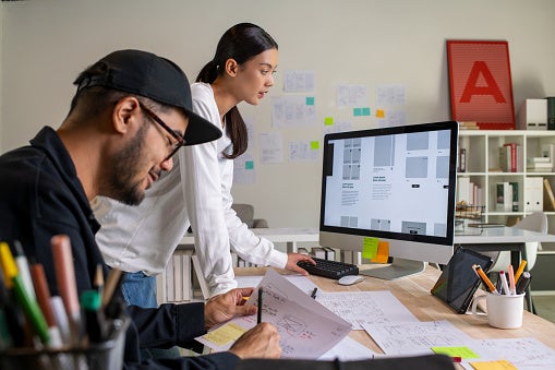 Two colleagues working on web design