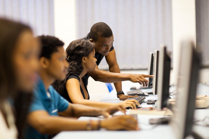 Students working on computer monitors