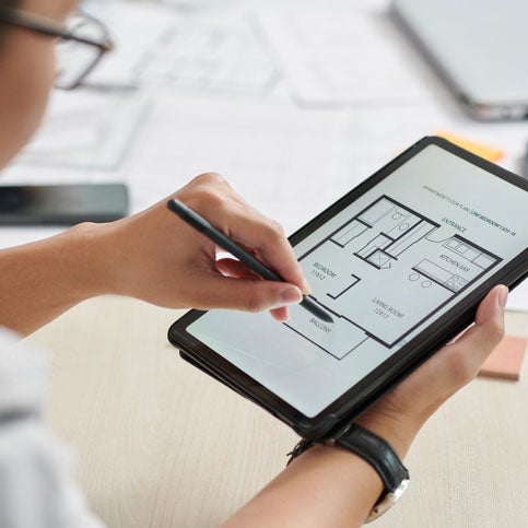 Architect working on floorplan on tablet