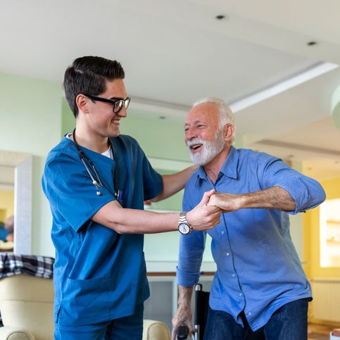 Nurse Aide helping patient