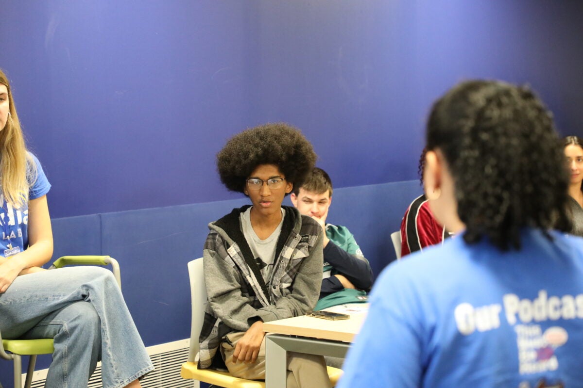 New Media Lab members participate in a meeting.